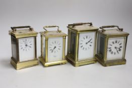 Four various brass carriage timepieces, tallest 14cm