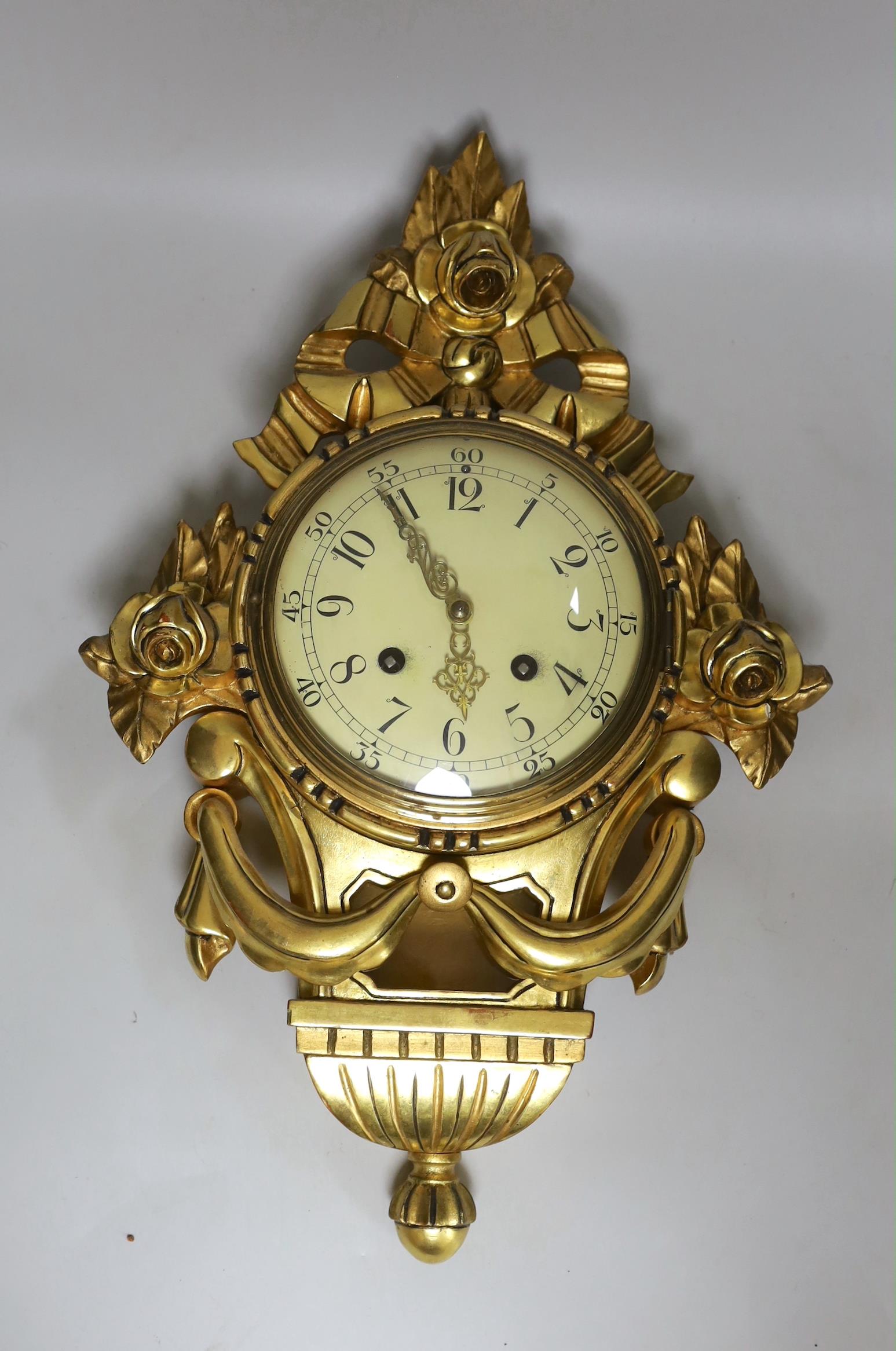 An early 20th century gilt wood cartel wall clock, 50cm high