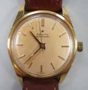 A gentleman's 18ct gold Zenith automatic bumper movement wrist watch, on associated leather strap,