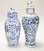 A Chinese blue and white ‘dragon’ vase and cover, and another, tallest 32cm; some damage