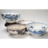 Four 18th century Chinese porcelain bowls (a.f), one with hardwood stand, largest 28cm diameter