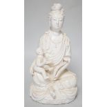 A blanc de chine figure of Guanyin and a child, 27cm