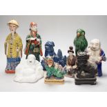 A group of assorted Chinese and Japanese pottery and porcelain figures, 19th/20th century, tallest