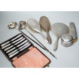 A George V silver mounted five piece dressing table set, two Georgian silver punch ladles and