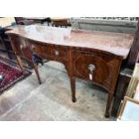 A George III style mahogany serpentine sideboard on square tapered legs, width 184cm, depth 63cm,