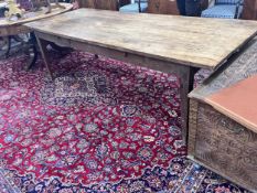 A 19th century French oak two drawer farmhouse table with a four plank top, on square tapered