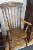 A Victorian elm and beech lathe back elbow chair, width 61cm, depth 48cm, height 112cm