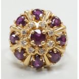 A modern 14ct gold, amethyst? and diamond chip cluster set domed dress ring, size M, gross weight