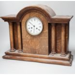 A 1920’s oak mantel clock, French gong-striking movement, 39cm high