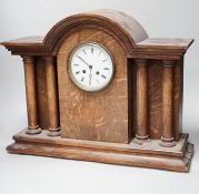 A 1920’s oak mantel clock, French gong-striking movement, 39cm high