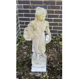A reconstituted stone garden statue of a flower girl, height 90cm