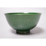 A Chinese green glazed ‘dragon’ tea bowl, 10cm diameter