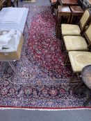 A Tabriz burgundy ground carpet, 460 x 330cm