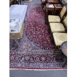 A Tabriz burgundy ground carpet, 460 x 330cm