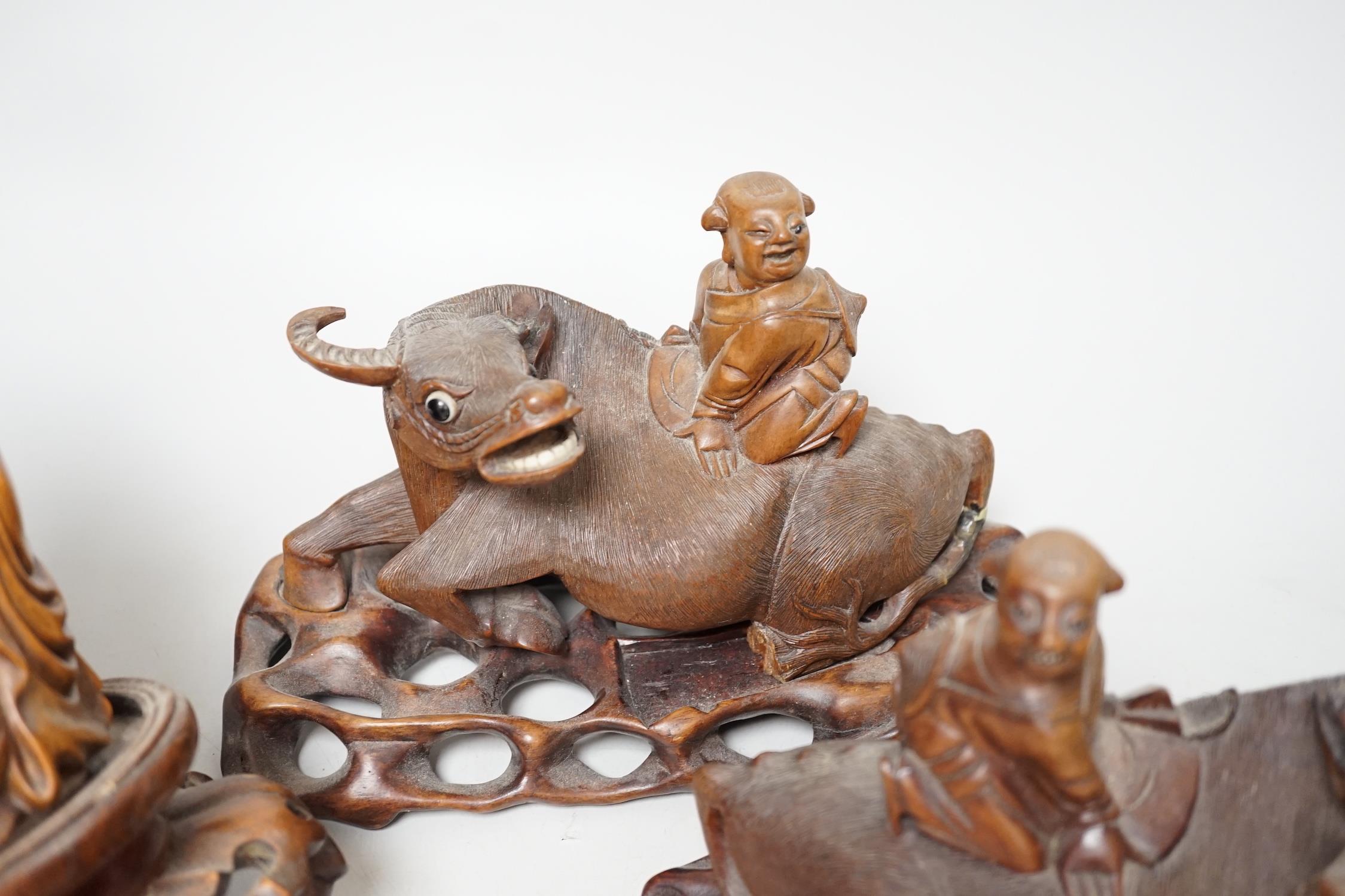 A pair of Chinese carved hardwood buffalo carvings, and a similar figure of a luohan, latter - Image 3 of 8