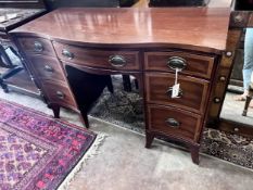 A reproduction 'Drexel Furniture' serpentine mahogany kneehole dressing table, width 117cm, width