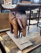 An African Ashanti style carved hardwood elephant stool, width 59cm, depth 32cm, height 58cm