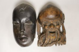 A Chinese Shou Lao wooden mask and an African mask, 26.5cm high