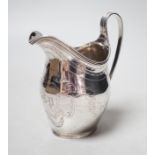 A George III engraved silver helmet shaped cream jug, Peter, Ann & William Bateman, London, 1802,