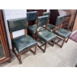 A set of five George VI oak and green leather 'House of Parliament' chairs by R & H Mines,