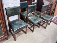 A set of five George VI oak and green leather 'House of Parliament' chairs by R & H Mines,