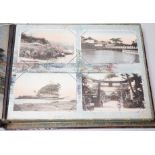 A Japanese photo album with handcoloured postcards of Japan, Ceylon, India etc.