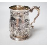 A George III silver mug, with late embossed decoration, John Scofield, 1772, 11.7cm, 9.9oz.