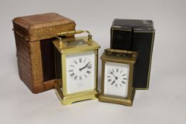 Two cased brass carriage cased clocks, one a repeating carriage clock, tallest 15cm high