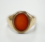 A 1930's 9ct gold and carnelian set oval signet ring, size Q, gross weight 5.7 grams.