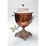 A copper tea urn with brass spigot tap and handles, 44cm