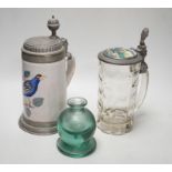 A German faience stein, dated 1819, a glass stein and an inkwell, largest 24cm