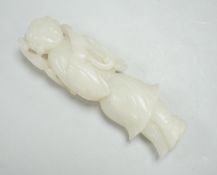 A Chinese white jade figure of a lady holding a sprig of fungus, 10cm high