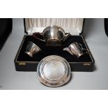 A cased Elizabeth II three piece silver tea set, Adie Bros. Birmingham, 1960, gross 23.7oz, with a