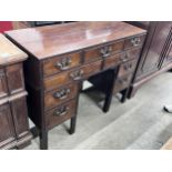 A George III Chippendale style mahogany blind fret kneehole desk, width 112cm, depth 48cm, height