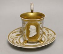 A Berlin porcelain cameo portrait cup and saucer, first half 19th century, cup 13cm to top of