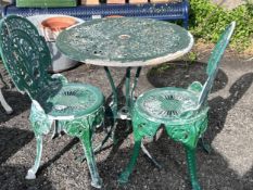 A circular aluminium garden table, diameter 69cm, height 72cm, together with two chairs