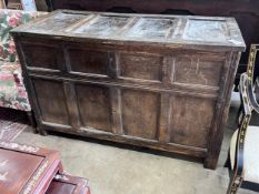 An 18th century panelled oak coffer, length 140cm, depth 61cm, height 92cm