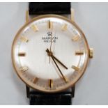 A gentleman's 9ct gold Marvin Revue manual wind wrist watch, with Marvin box.