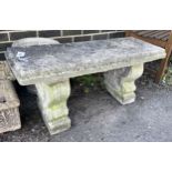 A reconstituted stone garden bench seat, length 98cm, depth 36cm, height 44cm