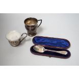 A George V silver christening mug, a cased Victorian silver christening spoon by George Adams and