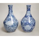 A pair of Chinese blue and white vases, 26cm high