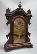 A 19th century American shelf clock, 60cm high, the glass decorated with the figure of the Statue of
