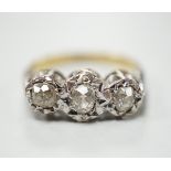 A yellow metal and illusion set three stone diamond ring, size M, gross weight 4.1 grams.