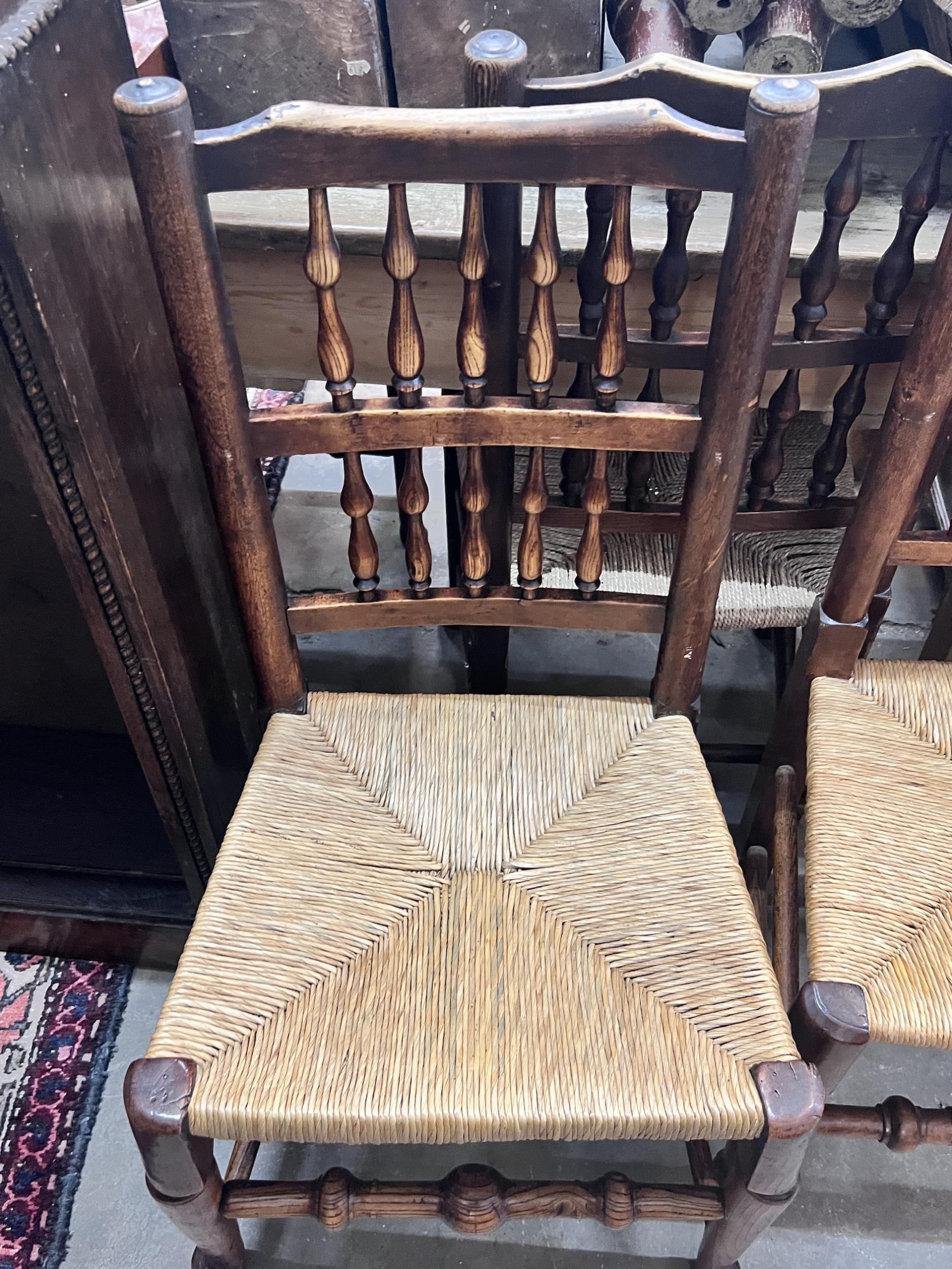 A harlequin set of six 19th century Lancashire ash and beach rush seat spindle back dining chairs - Image 2 of 2