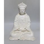A Chinese blanc de chine seated figure of Guanyin, 29cm high