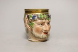 A Vienna porcelain satyr cup, impressed number 827, possibly for the date 1827, 10cm high