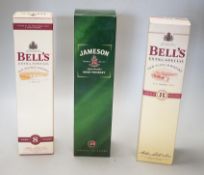 Three boxed bottles of Whisky
