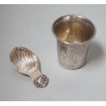 A Continental white metal tumbler cup, 66mm and a Mappin & Webb plated caddy spoon