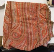 A 19th century Indian red ground paisley shawl, with a blue central medallion, 320 x 165cm