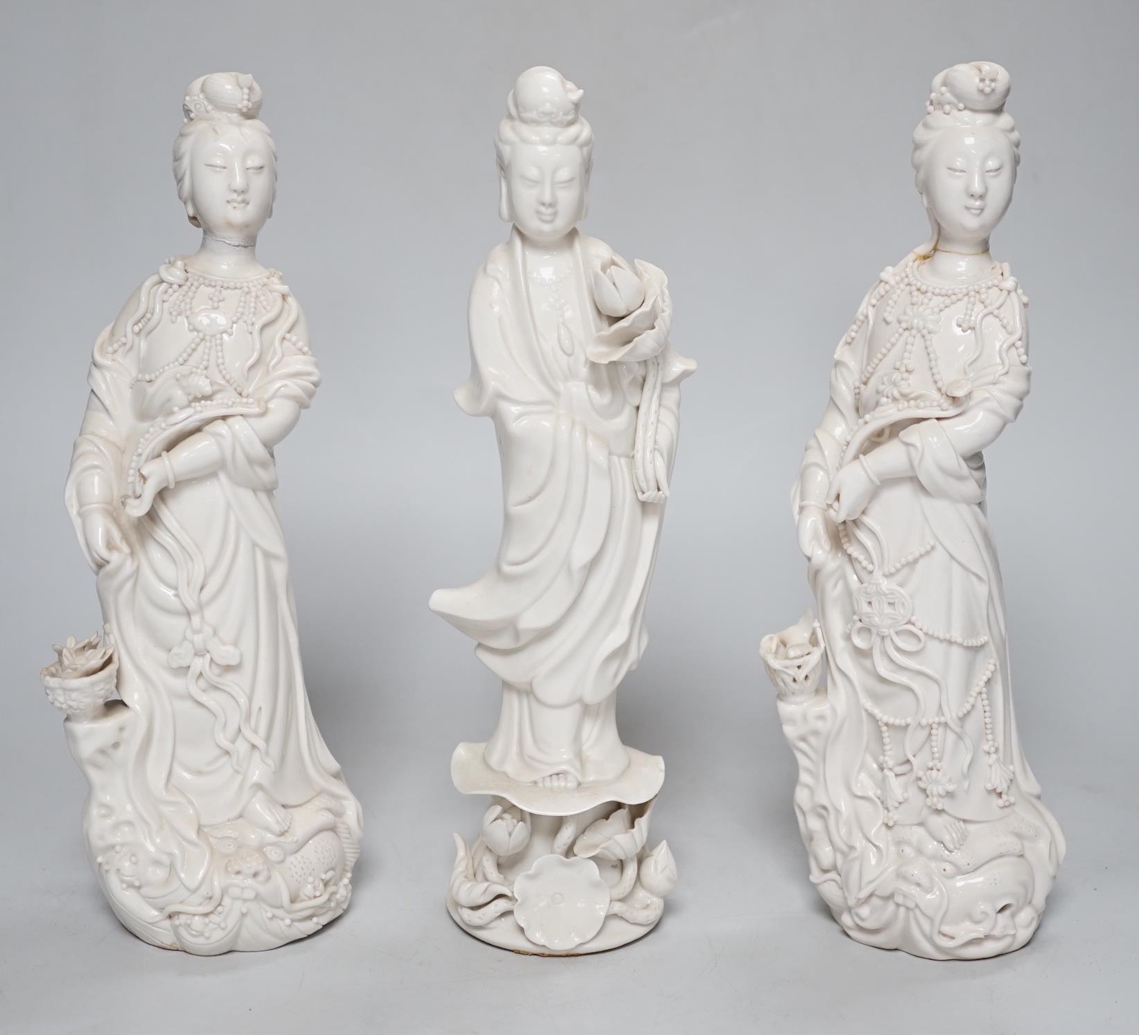 Three Chinese blanc de chine figures of Guanyin, 25cm